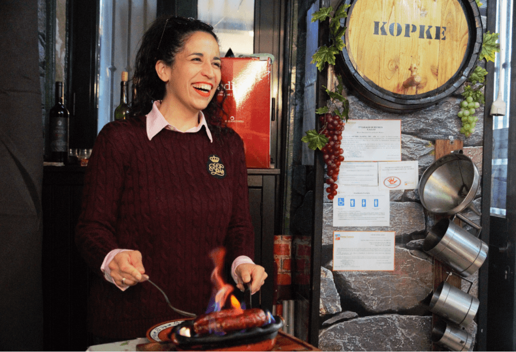 treasures of lisboa food tours in lisbon - ruthy grilling sausage