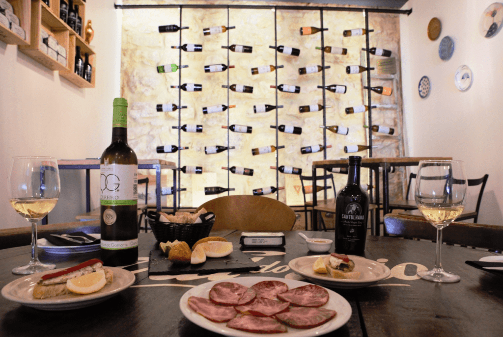 treasures of lisboa food tours in lisbon - table with food and wine